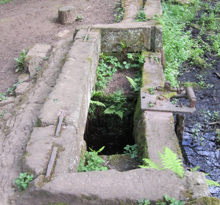 A small part of the shuttle mechanism survives on the Holme Head mill dam overflow. Photo: Sue Shaw May 2014.